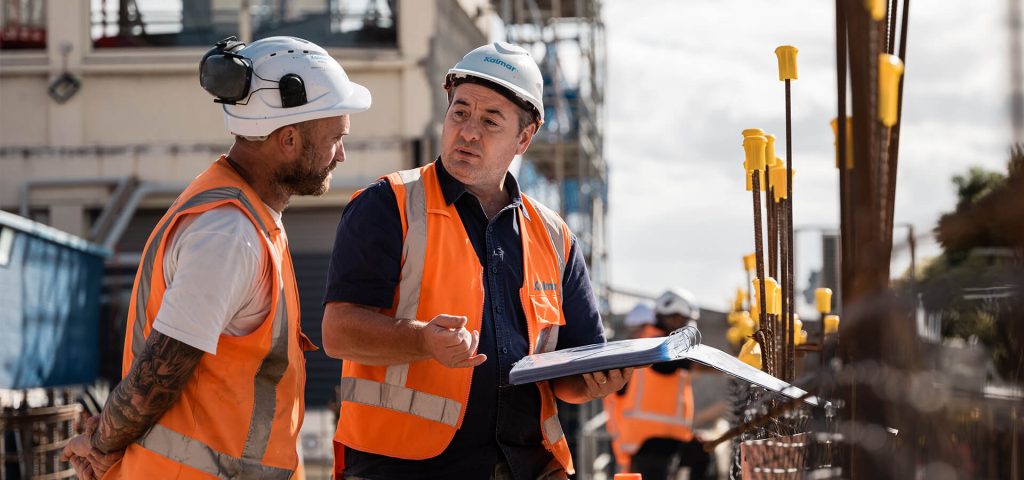 construction team reviewing plans highlighting fast payback and return on investment