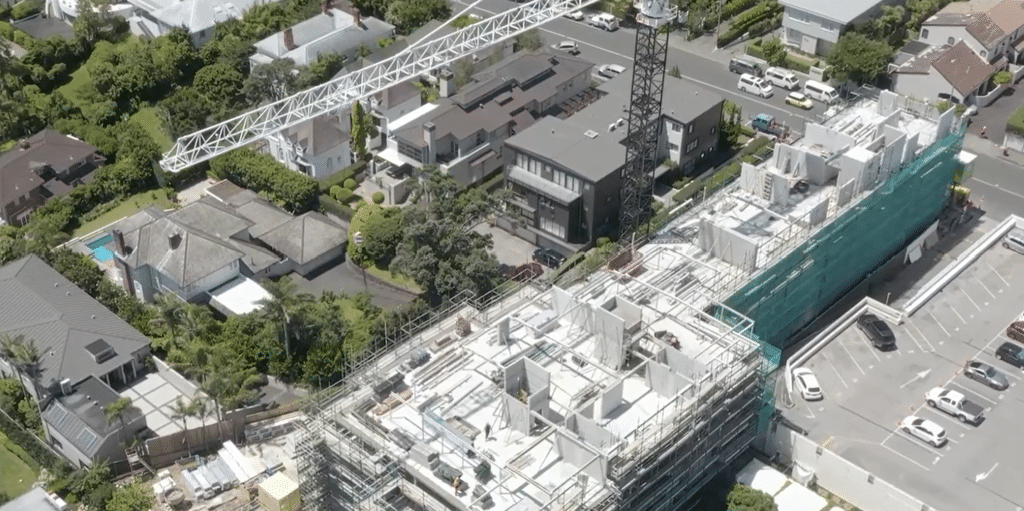 Aerial view of a CMP Construction site with a tower crane